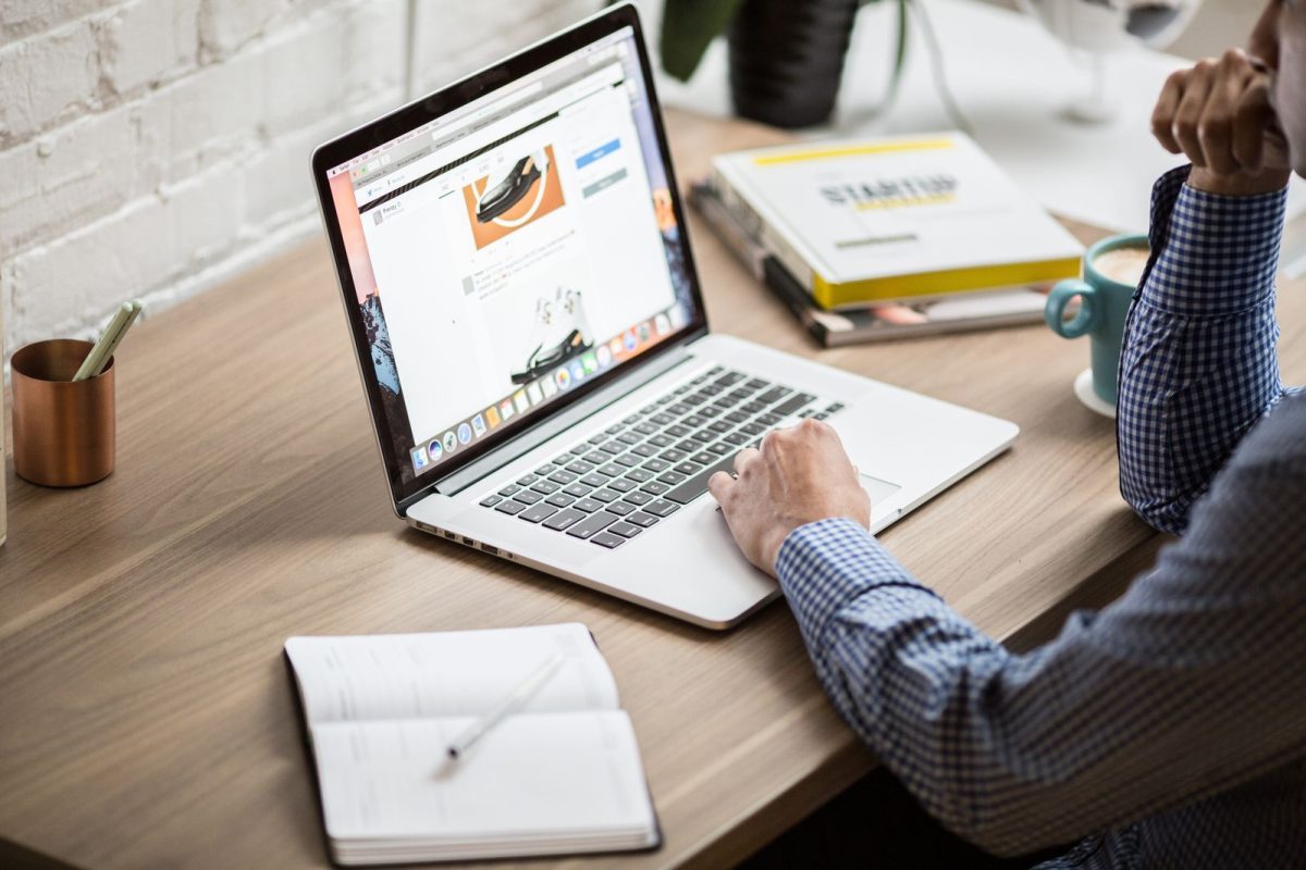 Person building a website on a laptop